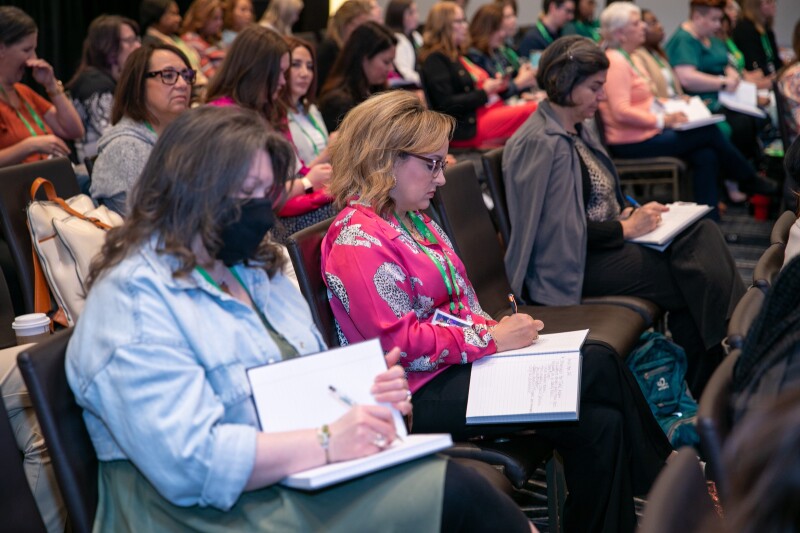 EAI attendees participating in a writing activity during the session.