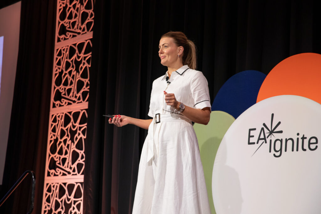 Ruth Kilah, speaker, on stage at EA Ignite Conference in Nashville, 2025