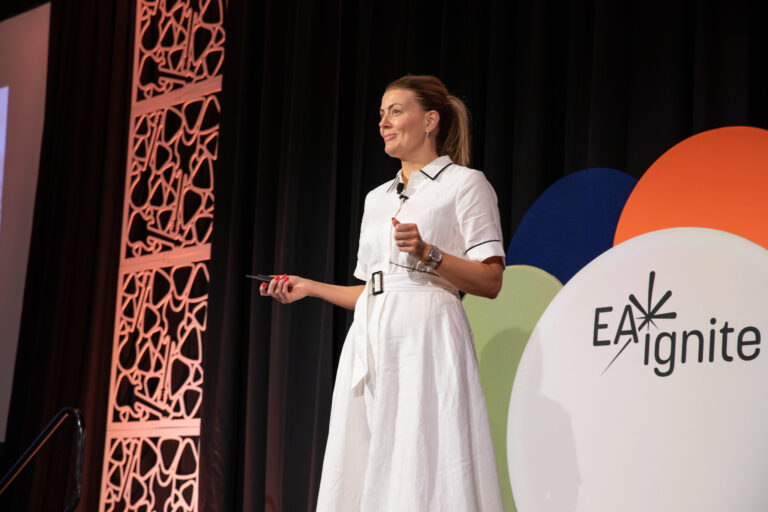 Ruth Kilah, speaker, on stage at EA Ignite Conference in Nashville, 2025